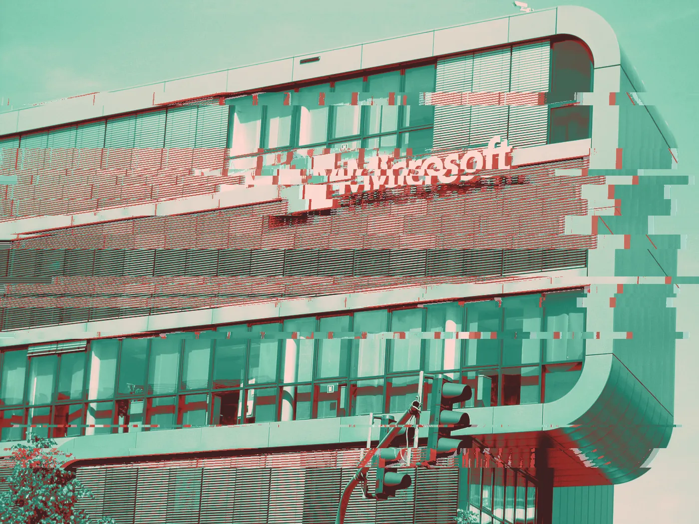 Microsoft logo on the side of a glass office building