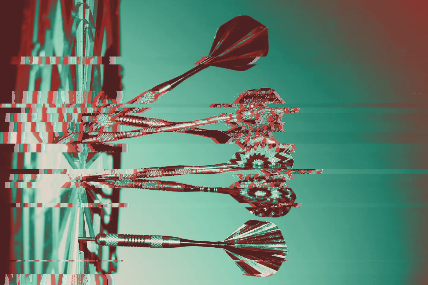 Darts clustered in the bullseye of a dartboard under blue light