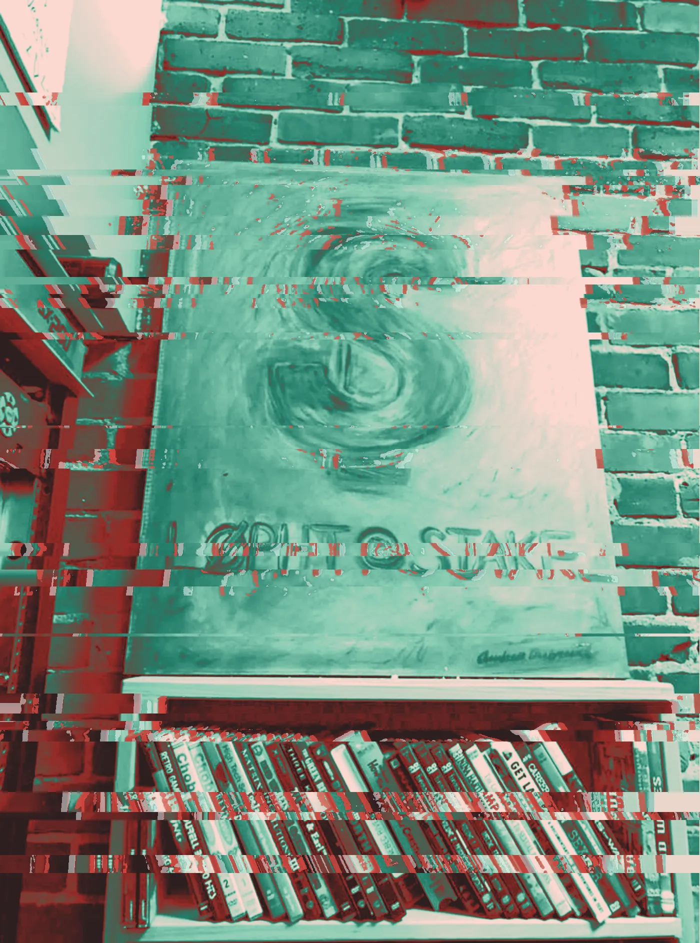 Green painting of a dollar sign reading L0pht @stake above a DVD shelf on brick