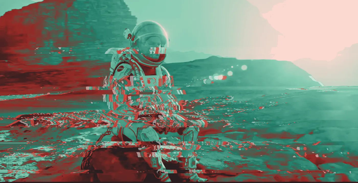 Astronaut in an orange and white spacesuit sitting on rocks in a hazy desert at sunset